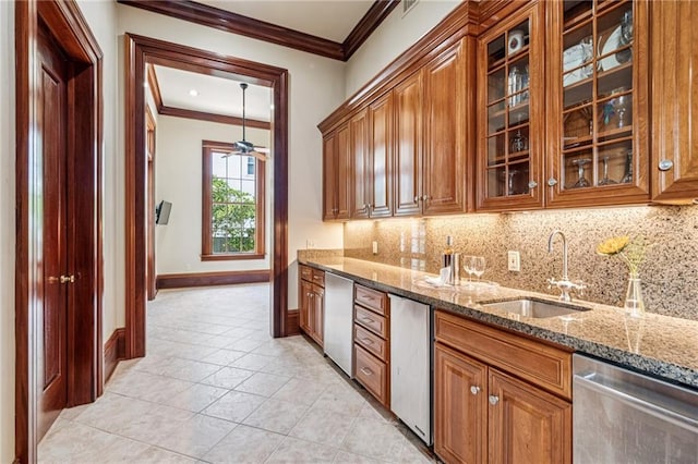 52 Tokalon Pl, Metairie, LA 70001 - kitchen with stainless steel dishwasher, crown molding, tasteful backsplash, light stone countertops, and brown cabinetry