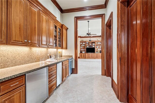 52 Tokalon Pl, Metairie, LA 70001 - bar area featuring crown molding, refrigerator, dishwasher, a ceiling fan, and decorative backsplash