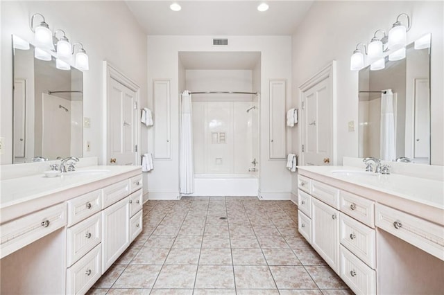 52 Tokalon Pl, Metairie, LA 70001 - bathroom featuring two vanities, tile patterned flooring, shower / bathtub combination with curtain, and recessed lighting