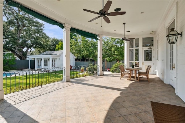 52 Tokalon Pl, Metairie, LA 70001 - view of patio / terrace featuring an outbuilding, a ceiling fan, french doors, and outdoor dining space