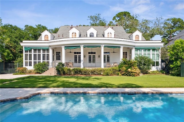 52 Tokalon Pl, Metairie, LA 70001 - rear view of property with ceiling fan and an outdoor pool