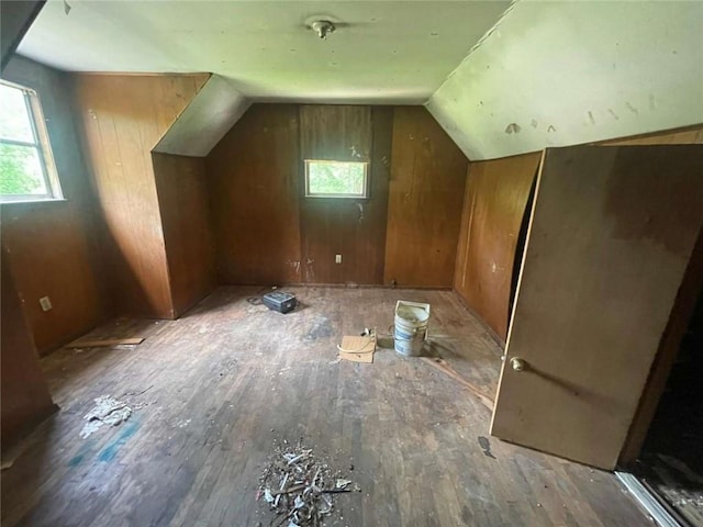 24180 Joe May Rd, Denham Springs, LA 70726 - additional living space featuring vaulted ceiling, wood-type flooring, and wood walls