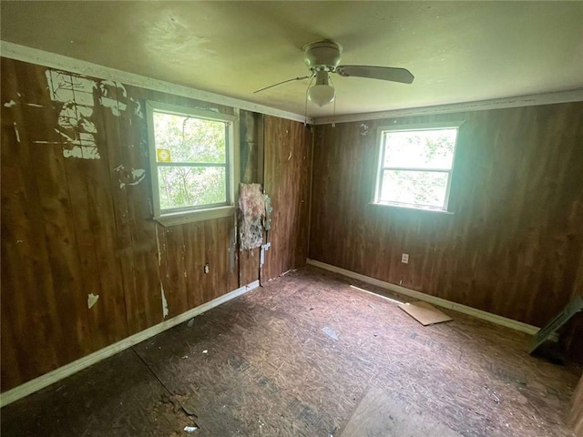 24180 Joe May Rd, Denham Springs, LA 70726 - unfurnished room with ceiling fan and wooden walls
