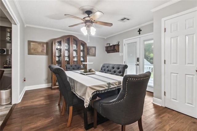 4969 Tasha Ln, Jean Lafitte, LA 70067 - dining room with french doors, ceiling fan, crown molding, and dark wood-type flooring