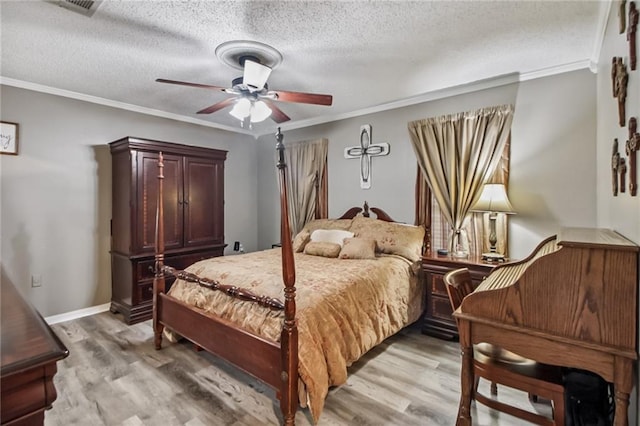 4969 Tasha Ln, Jean Lafitte, LA 70067 - bedroom featuring crown molding, light wood-type flooring, a textured ceiling, and a ceiling fan