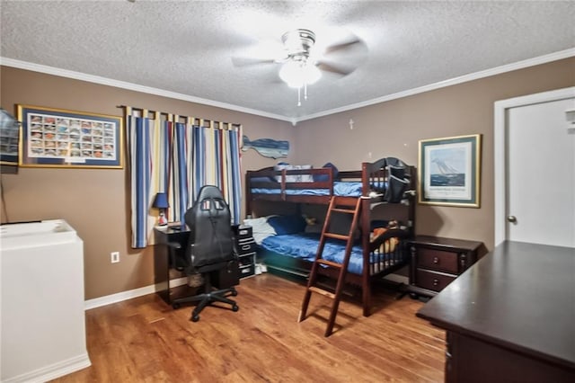 4969 Tasha Ln, Jean Lafitte, LA 70067 - bedroom featuring wood finished floors, a desk, a textured ceiling, crown molding, and a ceiling fan