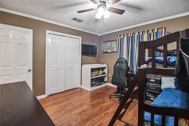 4969 Tasha Ln, Jean Lafitte, LA 70067 - office area with wood finished floors, a textured ceiling, ceiling fan, and ornamental molding