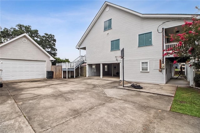 4969 Tasha Ln, Jean Lafitte, LA 70067 - view of property exterior with stairs, an outdoor structure, and a detached garage