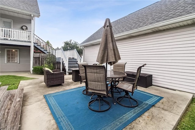 4969 Tasha Ln, Jean Lafitte, LA 70067 - view of patio / terrace with stairs, outdoor dining area, and a wooden deck