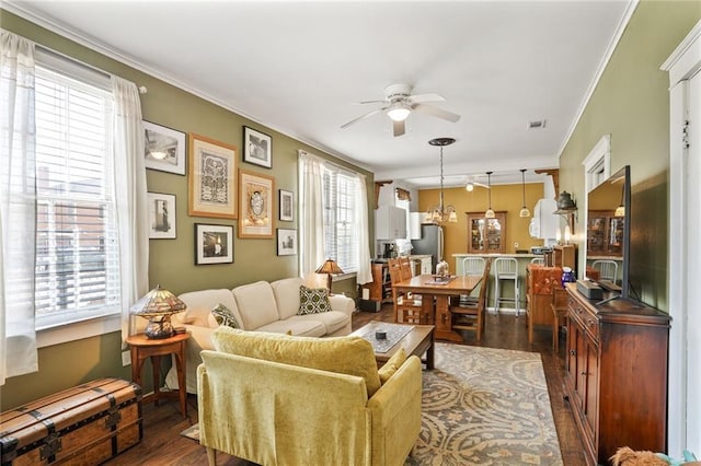 1717 Painters St, New Orleans, LA 70117 - living room with ceiling fan, dark wood-style floors, and ornamental molding