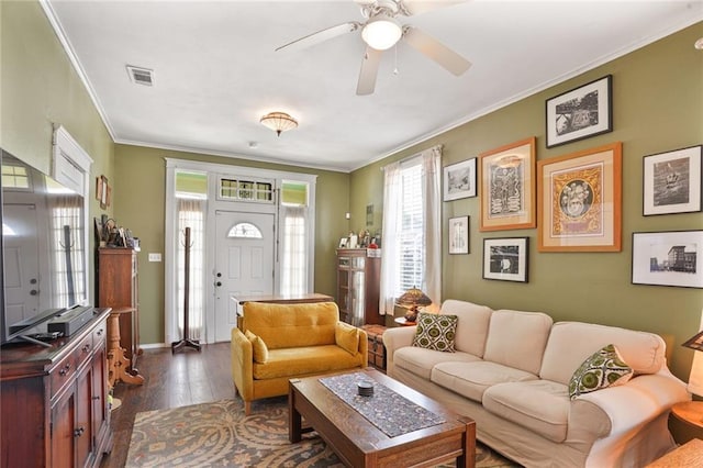 1717 Painters St, New Orleans, LA 70117 - living room featuring dark wood-style floors, crown molding, and ceiling fan