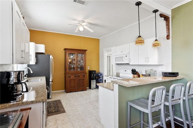 1717 Painters St, New Orleans, LA 70117 - kitchen with white appliances, a ceiling fan, white cabinetry, light stone countertops, and ornamental molding
