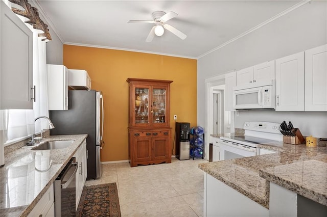 1717 Painters St, New Orleans, LA 70117 - kitchen featuring stainless steel appliances, ceiling fan, ornamental molding, light stone countertops, and white cabinetry