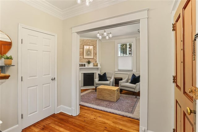 1824 Ursulines Ave, New Orleans, LA 70116 - living area featuring ornamental molding, wood finished floors, a chandelier, and a fireplace