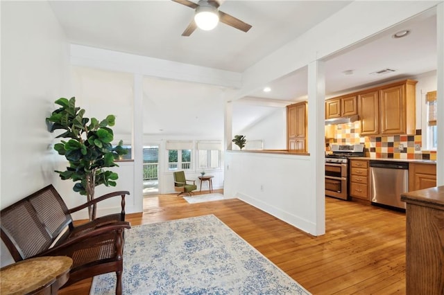 1419 Pine St, New Orleans, LA 70118 - living area with ceiling fan, light wood-style floors, and recessed lighting