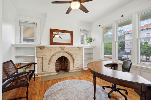 1419 Pine St, New Orleans, LA 70118 - living room featuring a ceiling fan, wood finished floors, and healthy amount of natural light