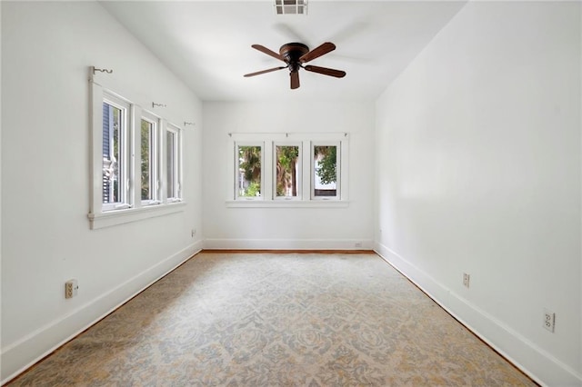 1419 Pine St, New Orleans, LA 70118 - spare room featuring ceiling fan and baseboards