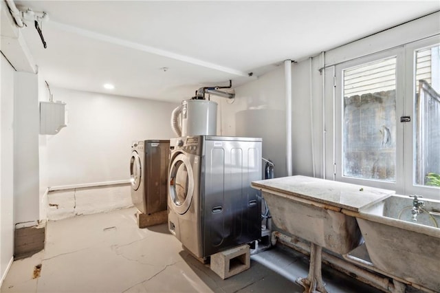 1419 Pine St, New Orleans, LA 70118 - laundry room featuring water heater and separate washer and dryer