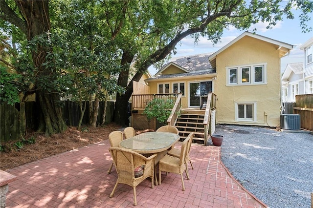 1419 Pine St, New Orleans, LA 70118 - back of house with stucco siding, a deck, a patio, and outdoor dining space