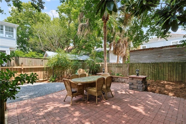 1419 Pine St, New Orleans, LA 70118 - fenced backyard featuring a patio area and outdoor dining space