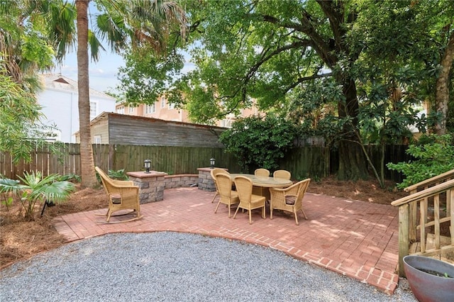 1419 Pine St, New Orleans, LA 70118 - fenced backyard featuring outdoor dining area and a patio area