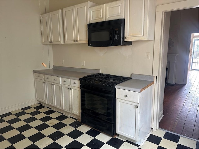 5827 Tchoupitoulas St, New Orleans, LA 70115 - kitchen featuring black appliances, light floors, white cabinetry, and light countertops