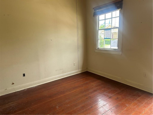 5827 Tchoupitoulas St, New Orleans, LA 70115 - unfurnished room featuring dark wood-style floors and baseboards