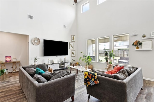 6031 Belfast Bend Ct, Slidell, LA 70461 - living area featuring a towering ceiling and wood finished floors