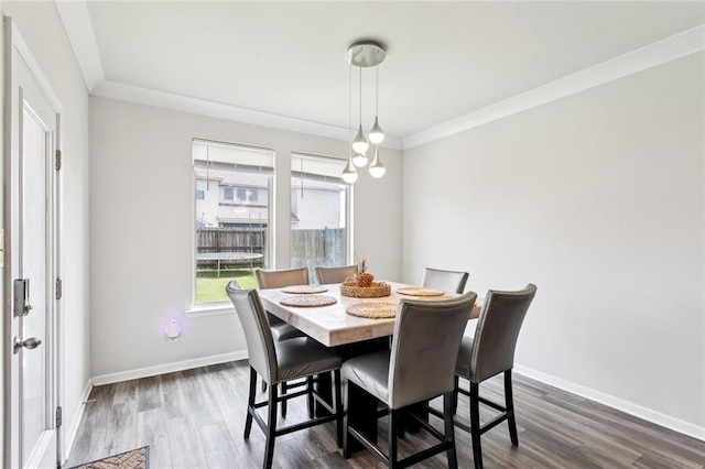 6031 Belfast Bend Ct, Slidell, LA 70461 - dining space featuring dark wood-type flooring and crown molding