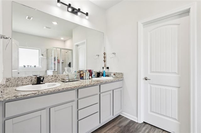 6031 Belfast Bend Ct, Slidell, LA 70461 - full bath with a stall shower, double vanity, and wood finished floors