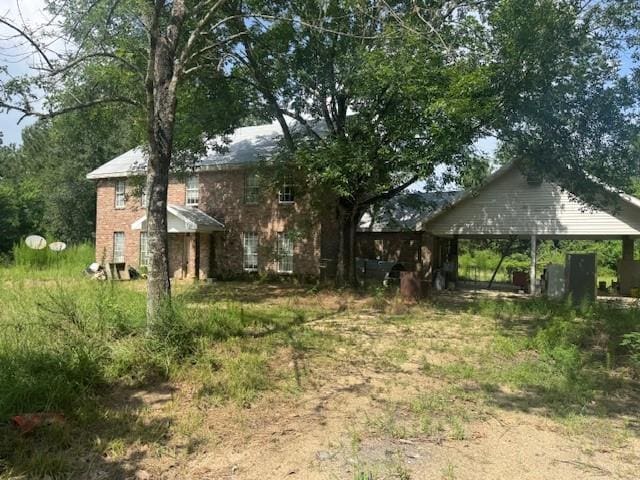85274 Kings Rd, Bogalusa, LA 70427 - view of yard with driveway and a carport