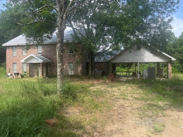 85274 Kings Rd, Bogalusa, LA 70427 - view of yard with a carport