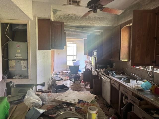 85274 Kings Rd, Bogalusa, LA 70427 - kitchen with stainless steel dishwasher, ceiling fan, and tile countertops