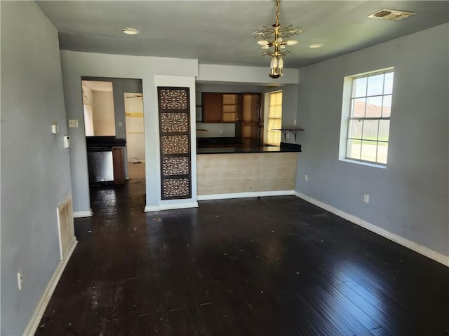 4440 Werner Dr, New Orleans, LA 70126 - unfurnished living room featuring baseboards and wood finished floors