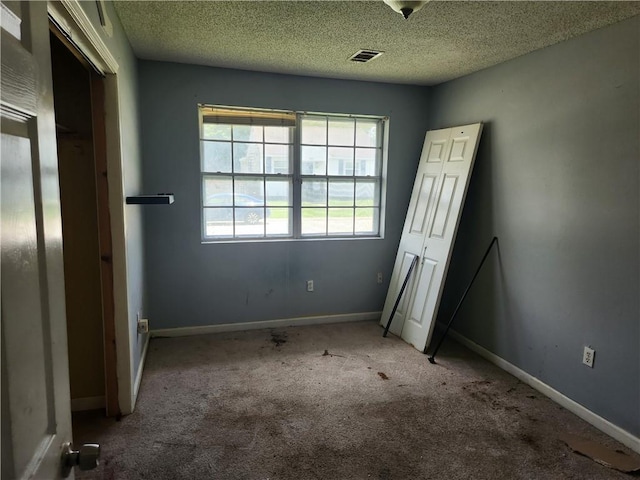4440 Werner Dr, New Orleans, LA 70126 - unfurnished bedroom featuring carpet flooring and a textured ceiling