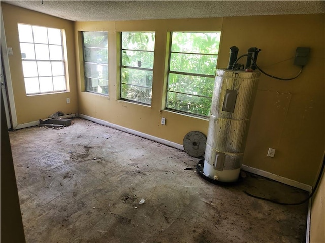 4440 Werner Dr, New Orleans, LA 70126 - spare room with water heater and a textured ceiling