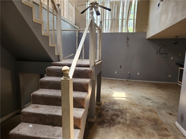 4440 Werner Dr, New Orleans, LA 70126 - stairs with ceiling fan and baseboards