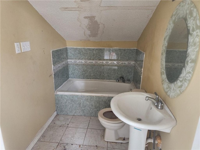 4440 Werner Dr, New Orleans, LA 70126 - bathroom featuring a garden tub and a textured ceiling