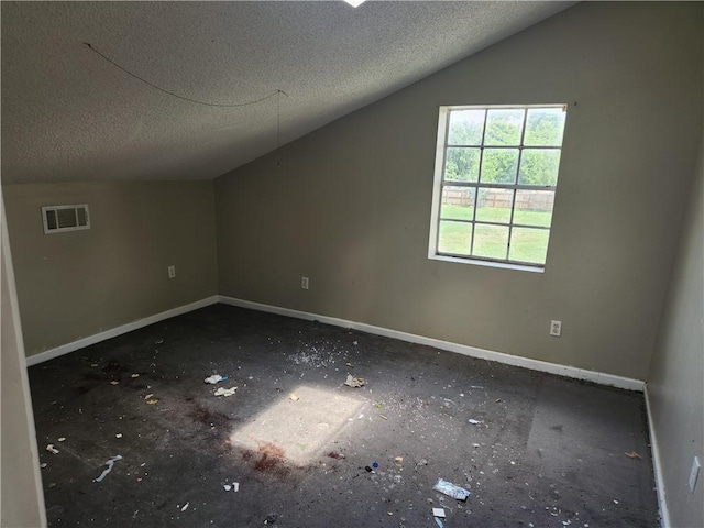 4440 Werner Dr, New Orleans, LA 70126 - additional living space with a textured ceiling and vaulted ceiling