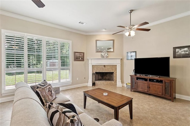 324 Nelson Landing Dr, Pearl River, LA 70452 - living room featuring ceiling fan, ornamental molding, light tile patterned flooring, and a fireplace
