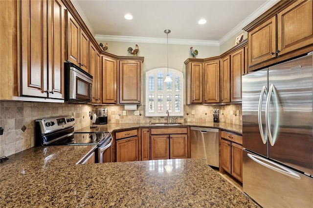 324 Nelson Landing Dr, Pearl River, LA 70452 - kitchen with stainless steel appliances, brown cabinets, tasteful backsplash, hanging light fixtures, and crown molding