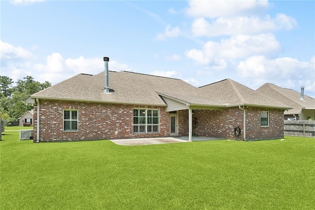 324 Nelson Landing Dr, Pearl River, LA 70452 - back of property with brick siding, roof with shingles, and a patio area