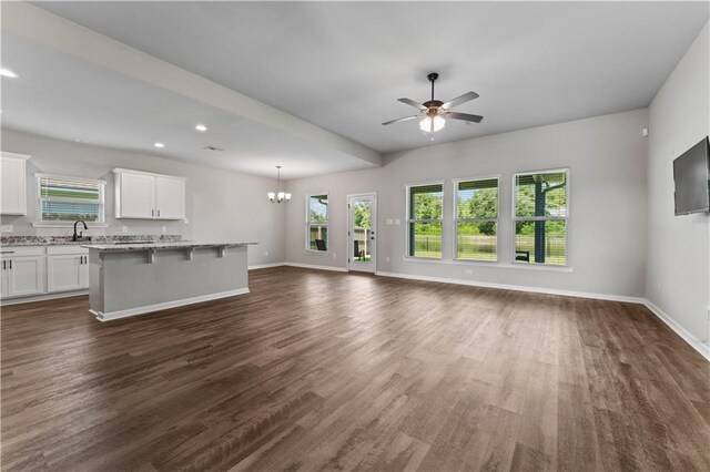42333 Jasper Ln, Ponchatoula, LA 70454 - unfurnished living room featuring ceiling fan, dark wood-style floors, a chandelier, and recessed lighting