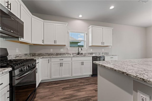 42333 Jasper Ln, Ponchatoula, LA 70454 - kitchen with black range with gas cooktop, dishwashing machine, stainless steel microwave, dark wood-style flooring, and recessed lighting