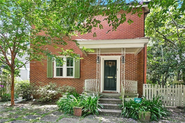 42 Crane St, New Orleans, LA 70124 - doorway to property featuring brick siding