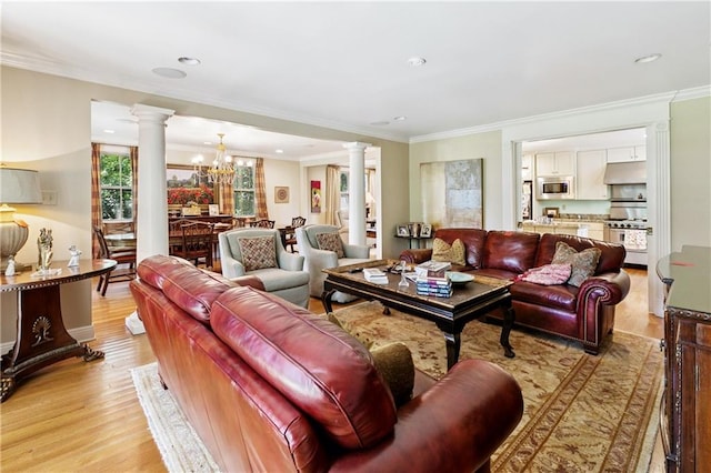 42 Crane St, New Orleans, LA 70124 - living area with decorative columns, light wood-type flooring, crown molding, a chandelier, and recessed lighting