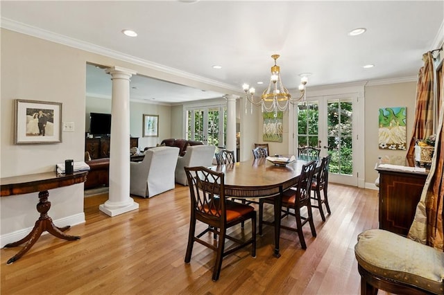 42 Crane St, New Orleans, LA 70124 - dining space featuring plenty of natural light, decorative columns, light wood-style floors, recessed lighting, and crown molding