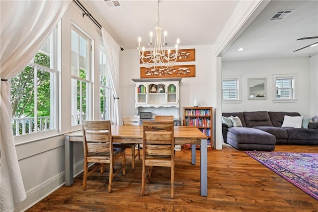 110 Atlantic Ave, New Orleans, LA 70114 - dining room featuring plenty of natural light, wood finished floors, and a chandelier