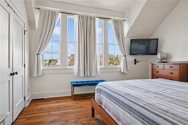 110 Atlantic Ave, New Orleans, LA 70114 - bedroom featuring wood finished floors and multiple windows