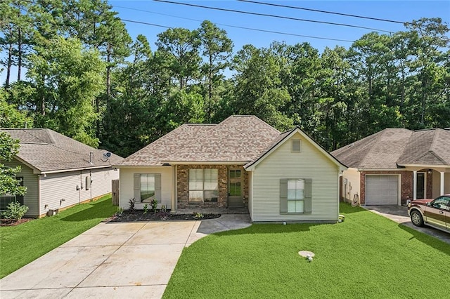 739 Chevreuil St, Mandeville, LA 70448 - view of front of home featuring concrete driveway, a front yard, and brick siding